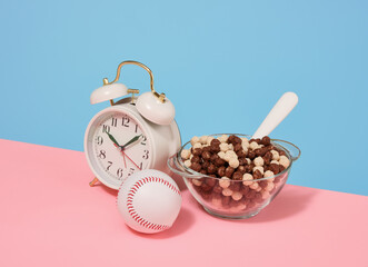 Obraz na płótnie Canvas Dry breakfast, baseball and vintage alarm clock. Proper nutrition and time of food.