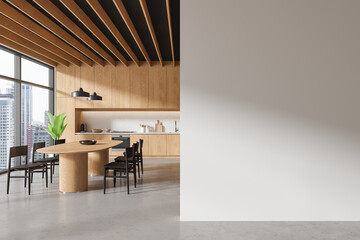 Wooden kitchen interior with table and blank wall