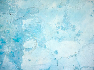 Old blue wall with crumbling plaster. Vintage texture or background