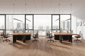 Cozy coworking interior with pc desktop, world clock and panoramic window