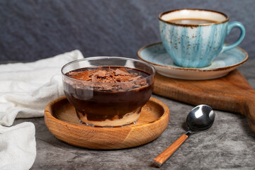 Obraz na płótnie Canvas Supangle dessert. Spangle and chocolate pudding in bowl on dark background