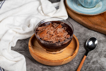 Supangle dessert. Spangle and chocolate pudding in bowl on dark background. Close up