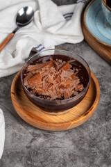 Supangle dessert. Spangle and chocolate pudding in bowl on dark background. Close up