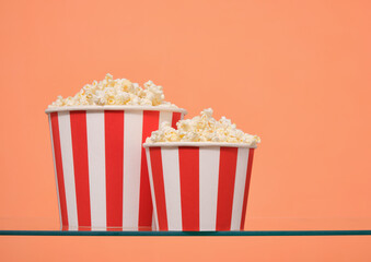 Two large buckets of delicious salted popcorn. Copy space for text.