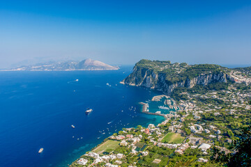 Obraz premium The breath takingly beautiful view of Marina Grande from above on the road to Anacapri, Isle of Capri, Italy. 