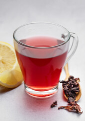 Hibiscus tea in glass mug.