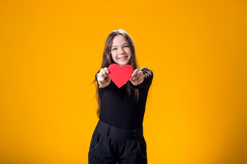 Child girl holding paper heart. Love, Valentine day concept