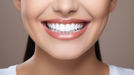beautiful woman with beautiful smile on grey background. - Teeth whitening.