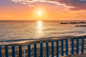 amazing view from a balcony of hotel to a nice sea gulf with beautiful sunrise or sunset, rocks and...