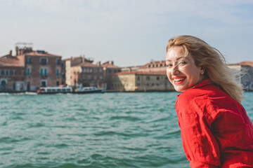 Fototapeta na wymiar Vacation in Venice - Italy. Concept of tourism and holidays. Woman in city scene