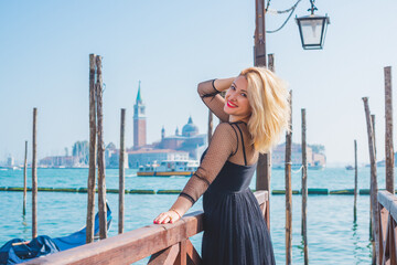 Vacation in Venice - Italy. Concept of tourism and holidays. Woman in city scene