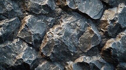 Rough natural stone wall texture with varied shapes and sizes, ideal for backgrounds and construction themes.