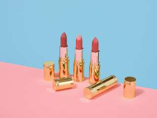 Some lipsticks on the table. Colorful creative makeup.
