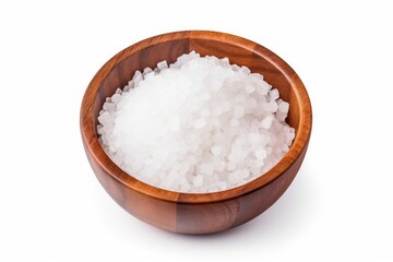 Closeup view of sea salt in wooden bowl on white background