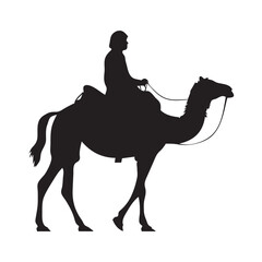 Silhouette of a camel with rider