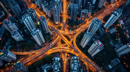 Fotobehang Urban cityscape at night with expressway traffic and bustling intersection roads, aerial view © Ilja