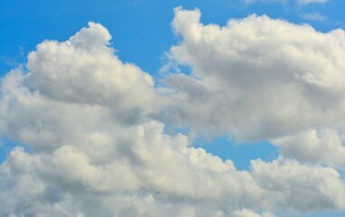 photo of white sky and bright blue clouds