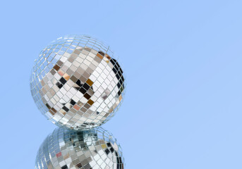 Mirror shiny disco ball and fun club party. Copy space for text.