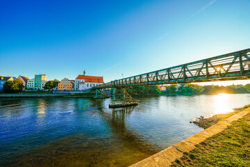 View of the Donau in the city of Regensburg and the Eiserner Steg pedestrian bridge.
