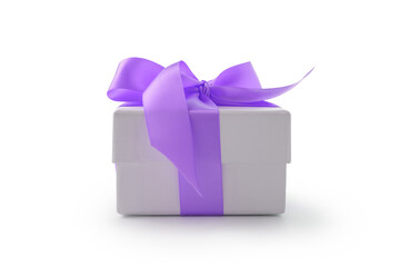 White gift box with violet ribbon bow isolated on white background