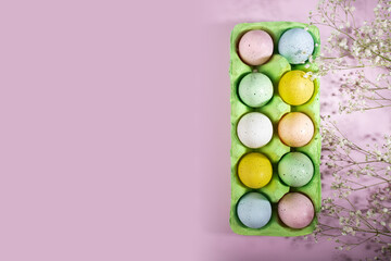 Festive holiday decor, Easter eggs in a box, spring flowers, pink background