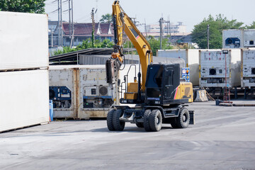 Hydraulic jackhammer from a construction truck drills into concrete floors.