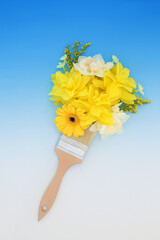 Surreal spring and easter flower paintbrush design on gradient blue white background. Fun floral nature abstract design with yellow flowers.