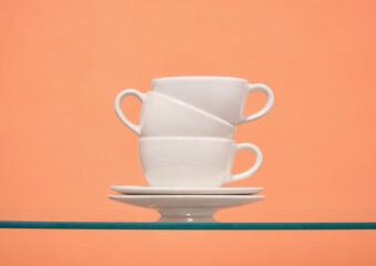 Ceramic white cups and plates. Tea or coffee, drinks.