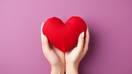 Fototapeta premium A voluminous heart lying in a woman's hands, a minimalistic composition with the symbolism of love. Generative AI