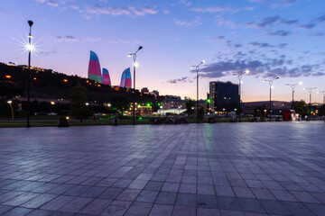 Baku, Azerbaijan - July 30, 2023: Flame Towers buildings dominating the city skyline on dramatic sunset