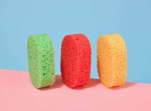 Three brightly colored washcloths on the table. Beauty shower concept. Supplies for personal daily hygiene.