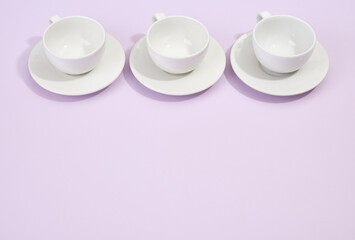 Set of clean tableware on a purple background. Copy space for text. Beautiful table setting.