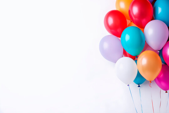 Colorful party balloons on white background.