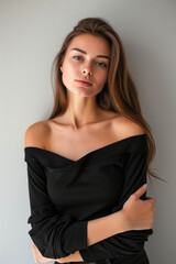 An attractive confident woman, 25-year-old, looking at the camera