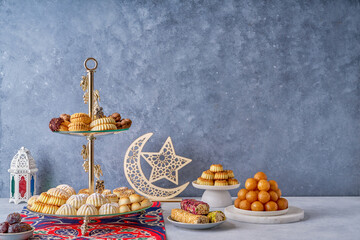 Assorted semolina maamoul or mamoul cookies , awameh or lokma with ramadan decor crescent moon....
