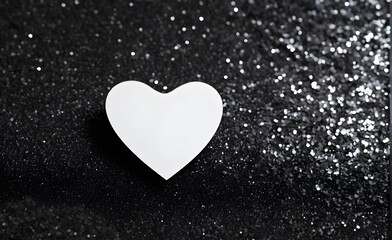 A small white heart on a sparkling black background. Generative AI