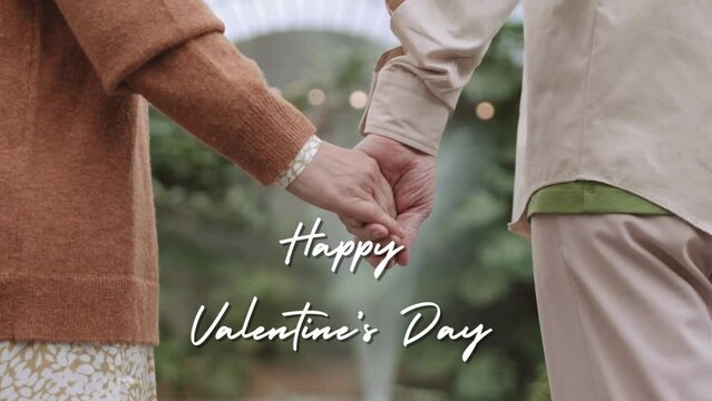 Animation of a couple holding hands and saying Happy Valentine's Day in the background.
