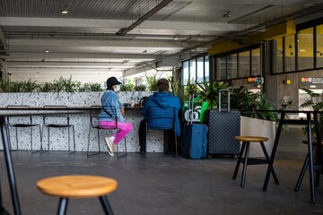 wearing a mask for travel at a cafe at melbourne airport australia