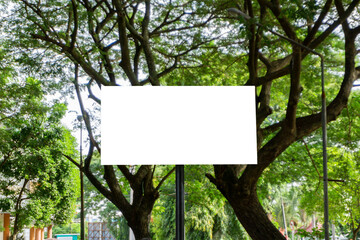 Empty white mockup information blank sign board in the park forest.  blank billboard in city park. Advertisement blank board against the tree