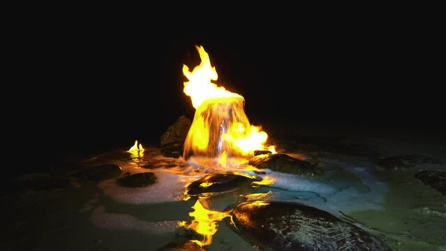 A burning spring in Kalmykia. A source of burning water in the village of Adyk, Russia. A source of fire water. Burning methane in the water. Cold fire. 4K Video