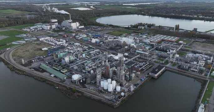 Chemical manufacturing, production of polymers. Lagre industrial facility birds eye aerial drone view. Dordrecht, the Netherlands.