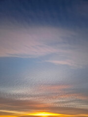 Obraz premium Beautiful winter sunset sky background. Colorful dusk clouds