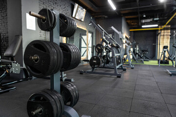 Fototapeta na wymiar Gym, equipped with weights and various exercise tools, creating environment for effective workouts and strength training