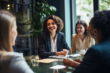 Portrait of Young business woman having a discussion with her team in modern office, collaboration and teamwork in business concept - Powered by Adobe