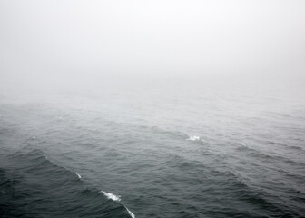 Russia Sakhalin Oblast 28.07.2023 Sea of Okhotsk in the fog. The line of the horizon, dissolving in...