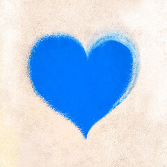 Blue heart on rustic wall