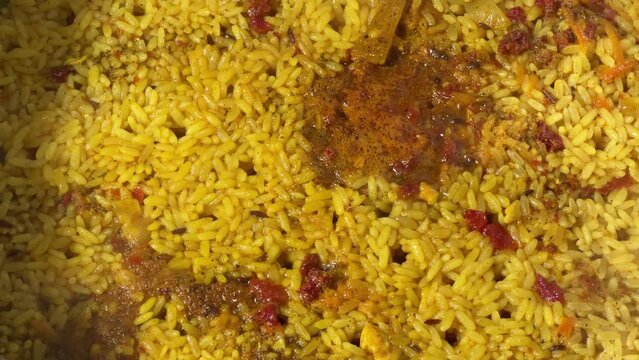 Surface of pilaf during preparation in a pot, top view
