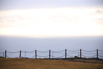 iron railing with atlantic ocean in background