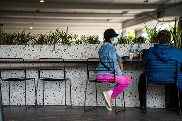 wearing a mask for travel at a cafe at melbourne airport australia