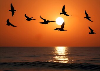 A flock of birds flying freely on a beach at a beautiful sunset, lovely silhouette background	